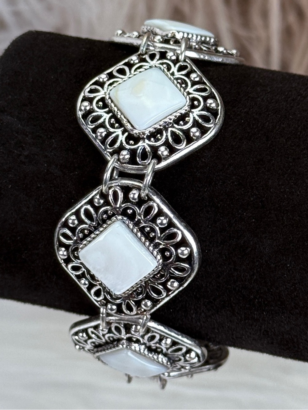 Beautiful Silvertone and white costume toggle closure bracelet